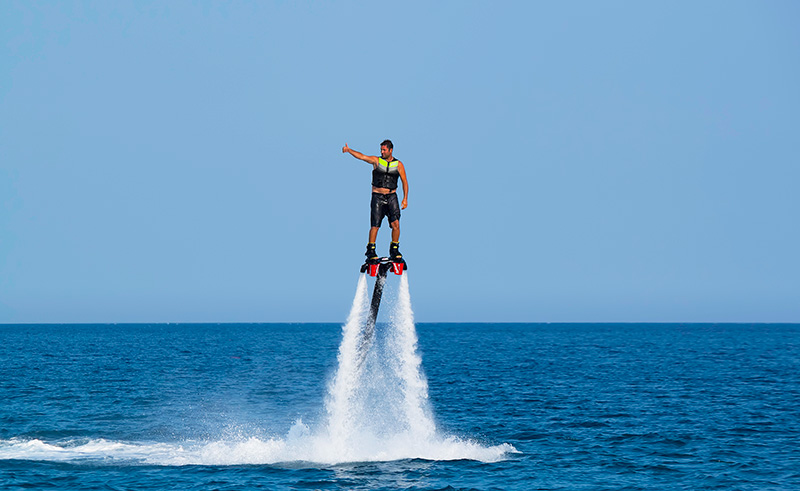 A person flyboarding in the waters near Cartagena, Colombia.
