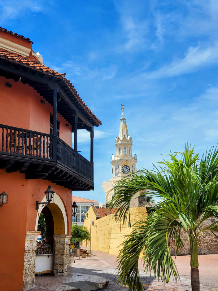 Stunning view of the vibrant Cartagena cityscape, with pastel-colored colonial buildings under a brilliant blue sky, reflecting the city's rich history and culture.