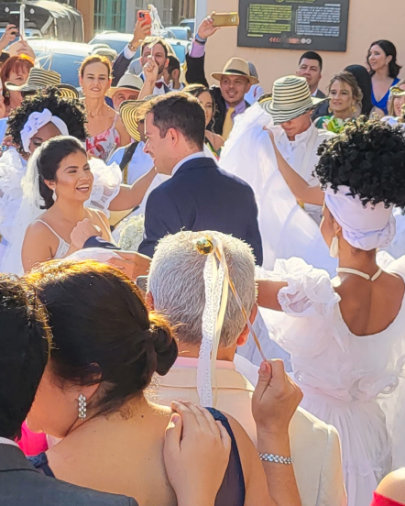 Bride and groom exiting a historic church in Cartagena, Colombia,